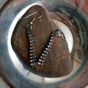 Silver dangling spine earrings